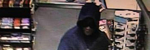A suspect pictured during a robbery at Caltex Penrose. Photo / NZ Police