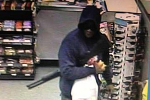 A suspect pictured during a robbery at Caltex Penrose. Photo / NZ Police