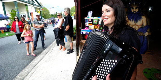 BOP Times Community Market arts and crafts Historic Village Tracey Collins entertains the crowd