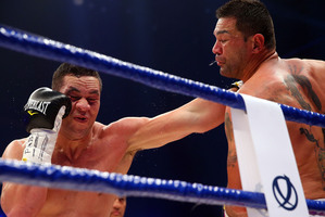 Kiwi Joseph Parker (left) knocked Marcelo Nascimento to the canvas in the opening round Picture / Getty Images
