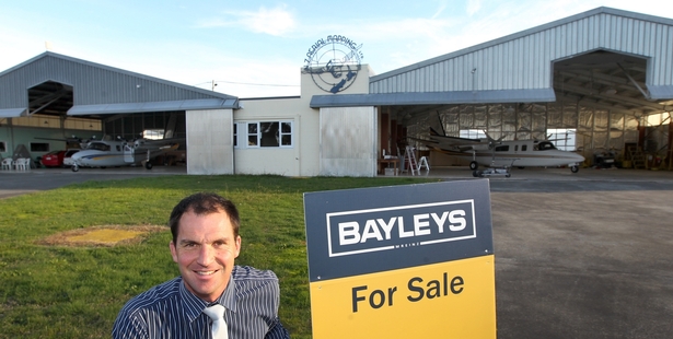 TAKING FLIGHT: Bayleys Hawke's Bay salesman Paul Garland at the NZ Aerial Mapping facility at Hastings Aerodrome.PHOTO/DUNCAN BROWN HBT141567-01