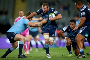 Luke Braid tackled by the Waratahs' Dave Dennis. Photo / Getty Images