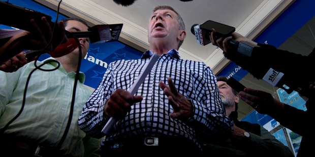 Maurice Williamson talks to the media outside his Pakuranga office after his resignation. Photo / Brett Phibbs