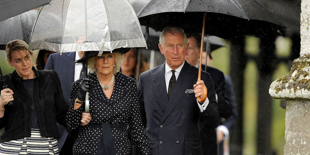 Britain's Prince Charles, right, and Camilla, Duchess of Cornwall, centre, arrive for the funeral of Mark Shand, the brother of the Duchess of Cornwall. Photo / AP