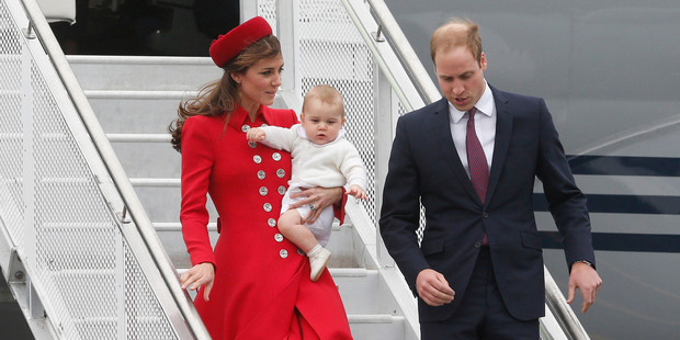 The Duke and Duchess of Cambridge with Prince George disembarking from the RNZAF jet after arriving at Wellington Airport. Photo / Mark Mitchell
