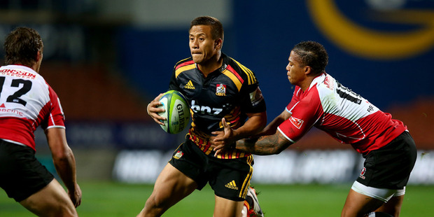 Tim Nanai-Williams of the Chiefs is tackled by Stefan Watermeyer (L) and Elton Jantjies (R) of the Lions during the round 12 Super Rugby match between the Chiefs and the Lions. Photo / Getty Images.