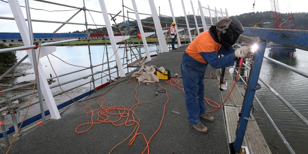 One of the Bowling Infrastructure Group team welds the handrail for the cycle/footbridge across the Waiarohia Stream.