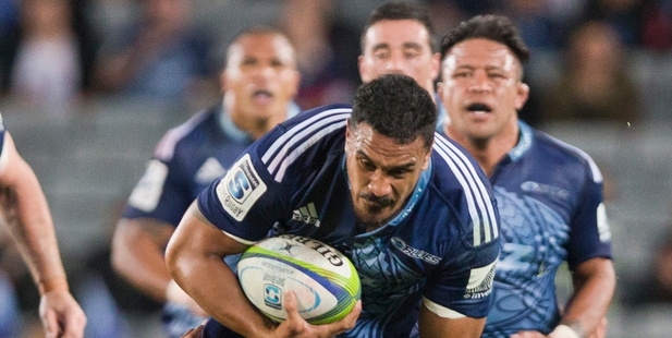 Jerome Kaino smashes over Kurtley Beale during the Blues' game against the Waratahs. Photo / Greg Bowker