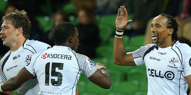 Lwazi Mvovo, middle, and Odwa Ndungane of the Sharks celebrate a try. Photo / Getty Images