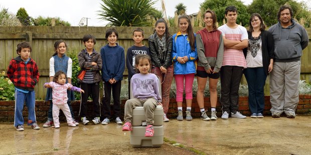 Nika and Shannah Taburuea (right) with 11 of their 12 children, (from right) Losena, Kita, Viena, Feangainga, Vini, Judah, Seth, Deborah with Taliah-Rose, Benji and Lielani. Photo / Stephen Jaquiery.