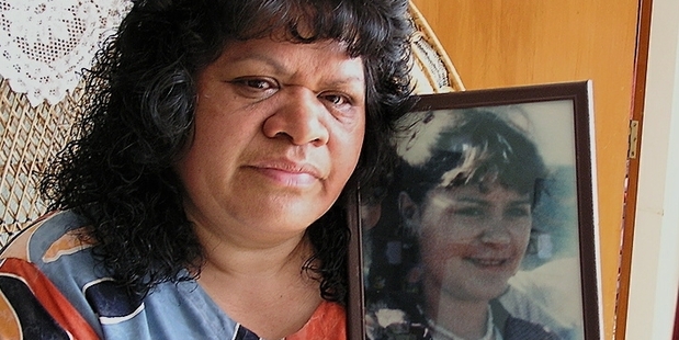 Ida Hawkins, 10 years ago, with a picture of her daughter, Colleen Burrows, 16, who was murdered in 1987. Photo/File