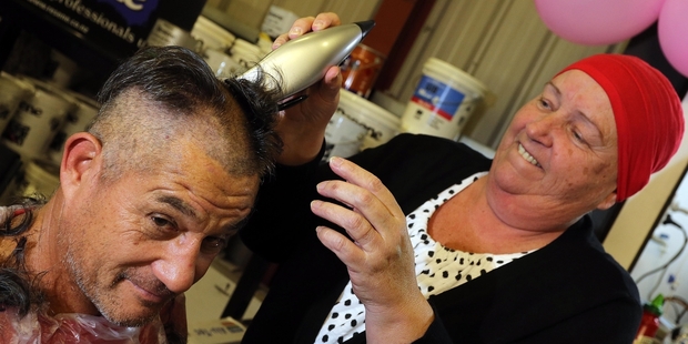 HAIR, DEAR: Sue Bidois gives her husband Jim a new look. PHOTOS/JOHN STONE