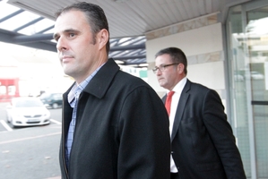 Adam Dunnett (left), outside Napier Courthouse, with lawyer Jonathan Krebs. Photo / HBT