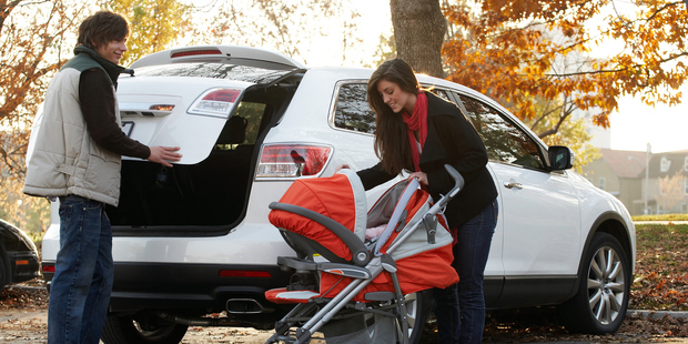 A two- or three-door car is just not practical to carry an infant. Photo / www.jupiterimages.com