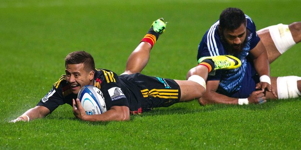 Chiefs player Tim Nanai-Williams dives in for a try despite the efforts of Blues player, Lolagi Visinia, during tonights Super Rugby match between The Chiefs and The Blues. Photo / Alan Gibson