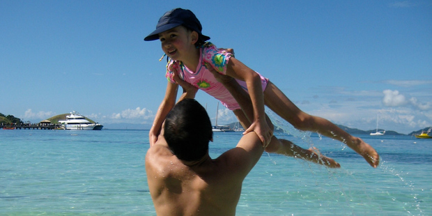 Scott Kara with his daughter Katie on the beach at Mana Island. Photo / Scott Kara