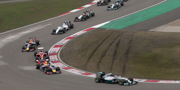 Mercedes driver Lewis Hamilton of Britain leads the field into turn three at the start of the 2014 Chinese Formula One Grand Prix. Photo / AP
