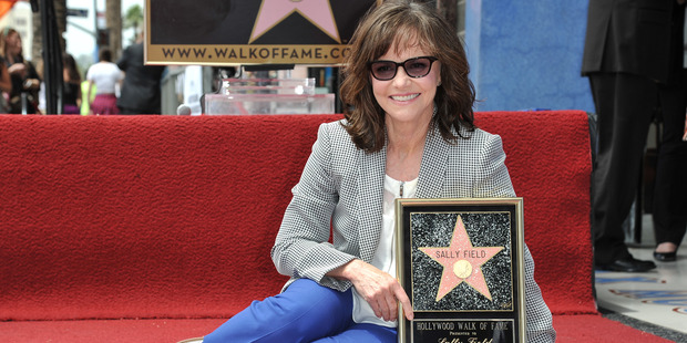 Actress Sally Field poses with her star on The Hollywood Walk of Fame in LA. Photo / AP