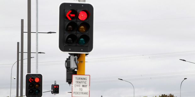 Delays from short-phasing traffic lights contribute to congestion that extracts a heavy cost in wasted petrol and harmful emissions. Photo / APN