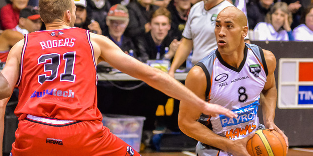 Paora Winitana drives as Matthew Rogers tries to impede his progress in Christchurch last night. PHOTO/Richard Connelly/Facebook.com/Gamefacenz