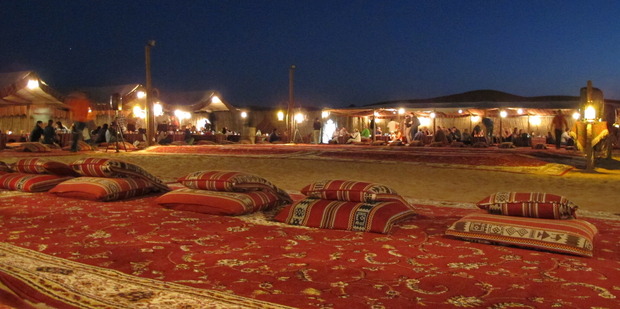 A Bedouin-style camp forms the backdrop on Arabian Adventures' Sundowner Safari Dune Dinner tours. Photo / James Hacon