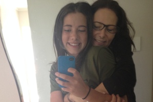 Janetta Mackay and her 13-year-old daughter snap selfies.