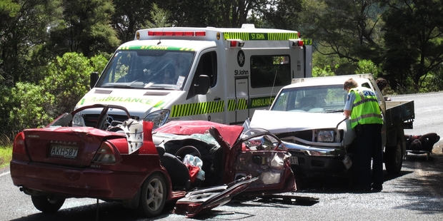 The vehicles collided near a bend on the Russell-Whakapara Rd. The injured girl was a back-seat passenger in the red Lancer. The ute's driver awaits treatment (right). Photo/Peter de Graaf