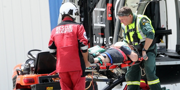INJURED: A woman injured when a jetboat crashed is taken aboard the Lowe Corporation Rescue Helicopter to be transported to Hawke's Bay Hospital. PHOTO/PAUL TAYLOR HBT134162-03
