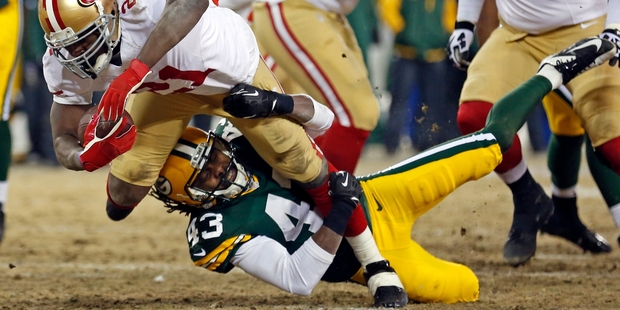 San Francisco 49ers' running back Frank Gore scores a touchdown against the Green Bay Packers yesterday. Photo / AP