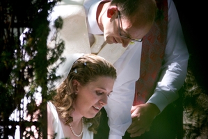 Liz Davies and David Bain sign the marriage certificate after their ceremony at Trent's Vineyard in Christchurch yesterday afternoon. Photo / Sarah Ivey