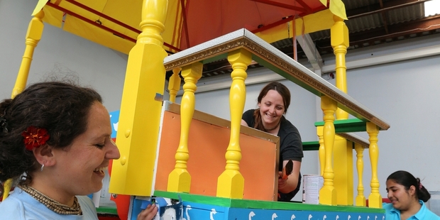 A 7-metre tall colourful chariot is being prepared by Whangarei's Hare Krishna devotees, from left Suvarna Manjari Dasi, Maia Cooper, Vaanipriya Diwan and Buddhi Wilcox, under the chariot, ahead of next week's Ratha Yatra Chariot Festival. Photo / John Stone