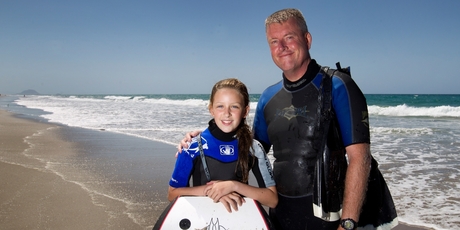 Warrick Smith and his daughter Ella Smith of Auckland, had a close encounter while boarding. Photo / Alan Gibson