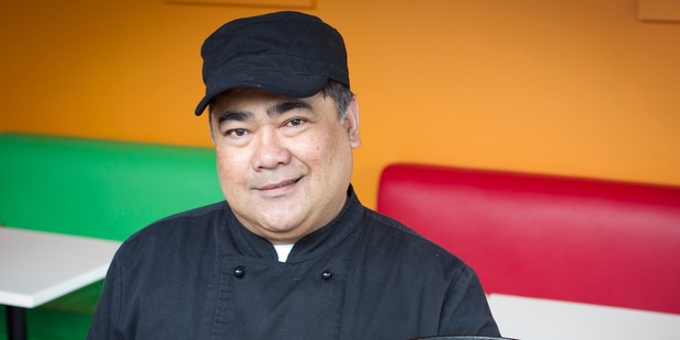 Chef Felix Lamela Jr from Island Joe's BBQ in Onehunga holds a plate of sisig, a nostalgic treat for many Filipinos. Photo / Natalie Slade