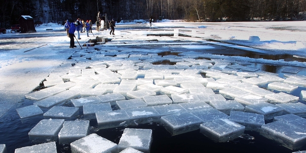 Blocks of ice float in Squaw Cove in Sandwich, New Hampshire, ready to be harvested. Photo / AP
