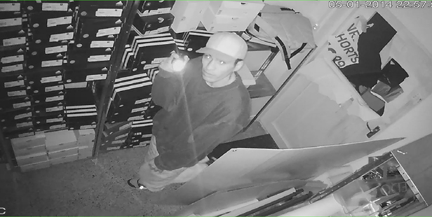 The burglar looked right down the lens of the security camera.