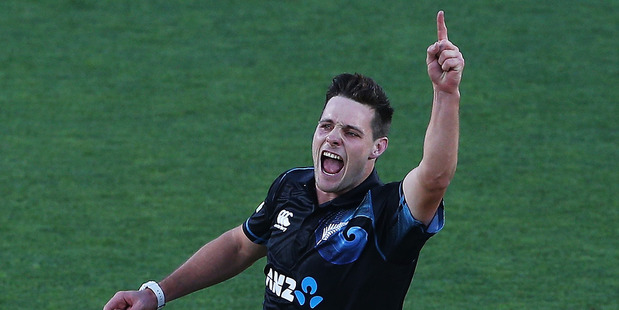 Mitchell McClenaghan of New Zealand celebrates the wicket of Denesh Ramdin of the West Indies during the first One Day International match between New Zealand and the West Indies. Photo / Getty Images