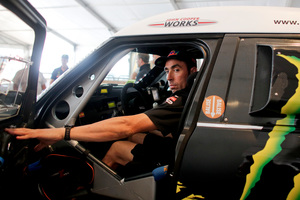 Mini driver Joan "Nani" Roma of Spain sits in his car during the technical verifications of the Dakar Rally 2014 in Rosario, Argentina. He leads the rally after stage three. Photo / AP
