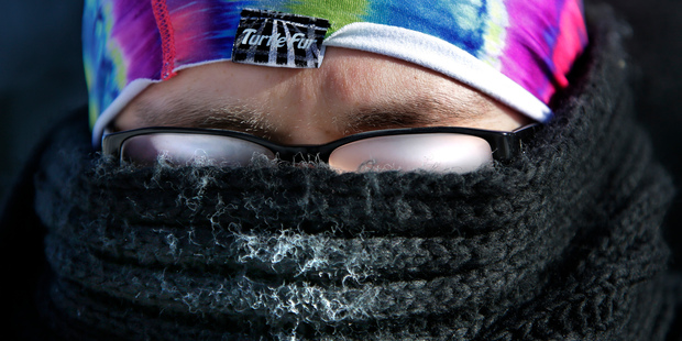 The cold weather makes vision challenging as Jobin Curow's glasses fog up while walking in subzero temperatures on the Lawrence University campus. Photo / AP
