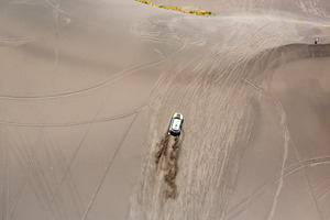 Mini driver Joan "Nani" Roma of Spain and co-pilot Michel Perin of France race up a dune during the second stage of the Dakar Rally between the cities of San Luis and San Rafael. Photo / AP