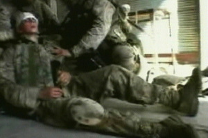 In this 2004 file photo, US soldiers tend to an injured comrade as they push their way to the centre of the insurgent stronghold of Fallujah, Iraq. Photo / AP
