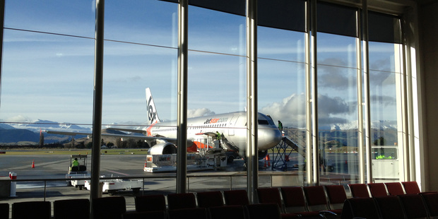 A Jet Star plane gets ready to depart from Queenstown airport. 4th June 2013. Photo / Chris Gorman