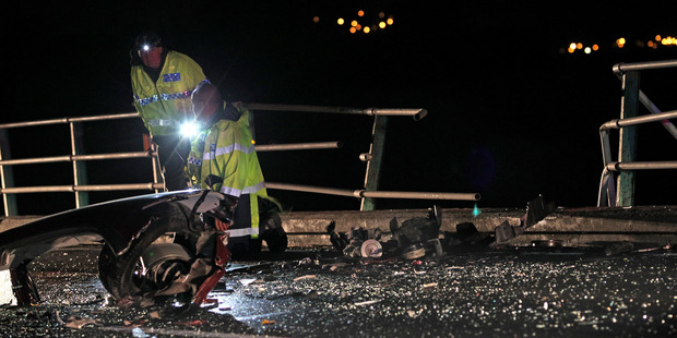 Emergency services at the scene of the fatal crash on Maungatapu Bridge. Photo/File