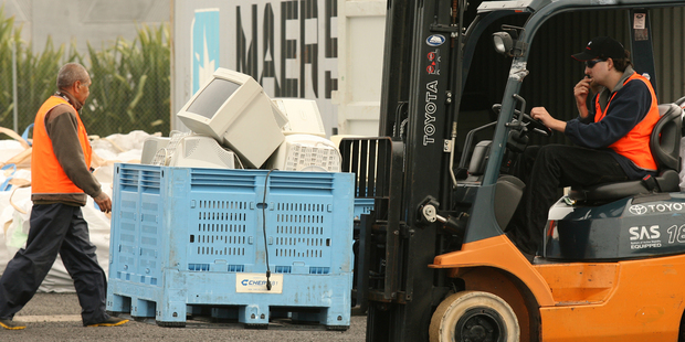 Scenes from eDay 2009. This depot at Smales Farm on the North Shore received over 1000 carloads of old computers, printers and other electronic equipment for recycling. Photo / NZ Herald