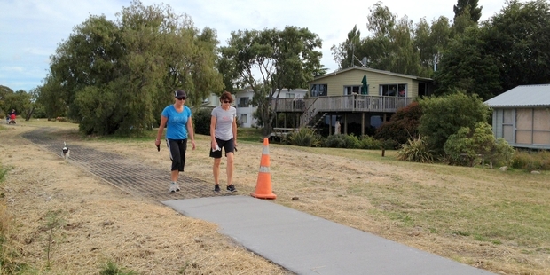 The section outside some objectors' homes will be made of plastic matting, instead of concrete, at additional cost.