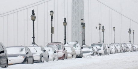Cars are covered with snow in front of the George Washington Bridge, in the Manhattan borough of New York. Photo / AP