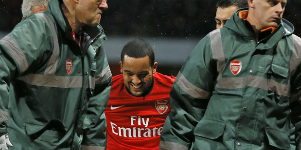Theo Walcott will miss the rest of the Premier League season and the FIFA World Cup. Photo / AP