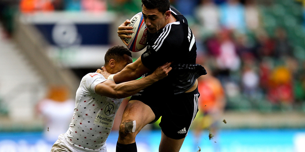 Bryce Heem fights through the tackle of England's Dan Norton during their game at Twickenham. Photo / Getty Images.