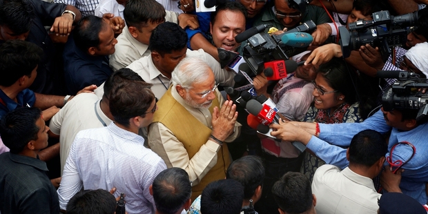 India's next prime minister Narendra Modi greets the media after seeking blessings from his 90-year-old mother in Gandhinagar. Photo / AP