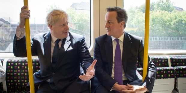 Mayor Boris Johnson and PM David Cameron, seen here campaigning, also joined forces to help a woman who'd collapsed in Harrow. Photo / AFP