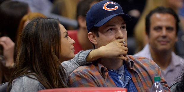 Actors Mila Kunis, left, and Ashton Kutcher are expecting their first child later this year. Photo/AP.